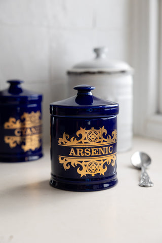 The What's Your Poison - Arsenic Jar styled on a white kitchen counter against a white wall.