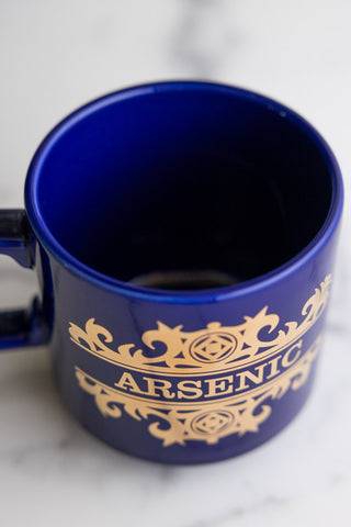 A close-up showing the brim of the What's Your Poison - Arsenic Mug.