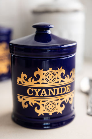 Close-up showing the gold detailing on the What's Your Poison - Cyanide Jar.