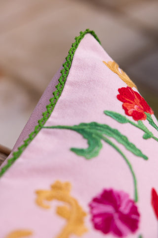 Detail shot of the trim on the Wild Embroidered Cushion.