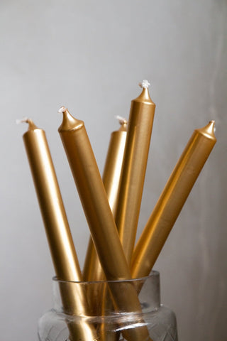 Close-up image of 5 Metallic Gold Beautiful Dinner Candles in a jar