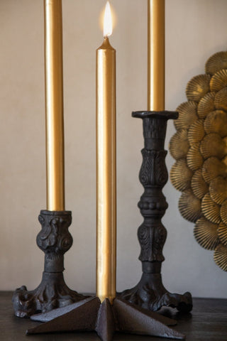 Image of 3 lit Metallic Gold Beautiful Dinner Candles in candlestick holders