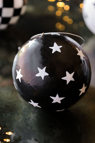 Close-up image of the Black Christmas Decoration With White Stars