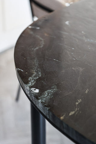 Close-up image of the marble detail on the Black Marble Dining Table