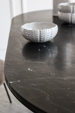 Close-up image of the top of the Black Marble Dining Table