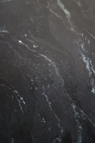 Image showing the marble pattern running through the Black Marble Dining Table