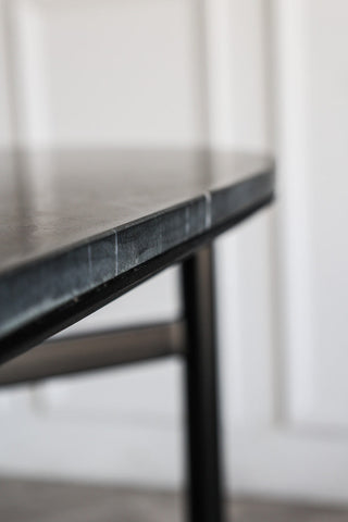 Image showing the thickness of the table top on the Black Marble Dining Table