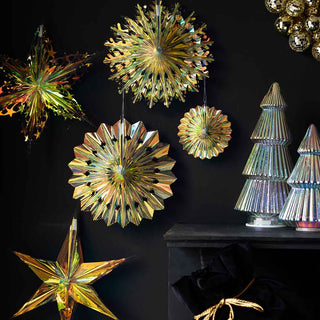 5 paper decorations with an iridescent shimmer. The decorations include a star, fan and circular design. To the right are two christmas tree decorations in silver.