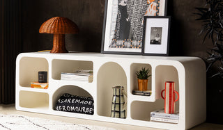 The Large White Alcove Sideboard / TV Unit styled with various accessories and art prints.