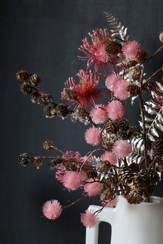 Close-up image of the arrangement featuring the Faux Silver Fern Leaf Stem