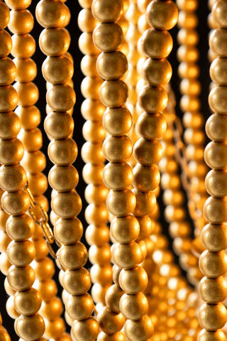 Detail shot of the beads on the Gold Star Shaped Beaded Statement Chandelier Light.