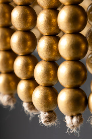 Detail shot of the end of the beads on the Gold Star Shaped Beaded Statement Chandelier Light.