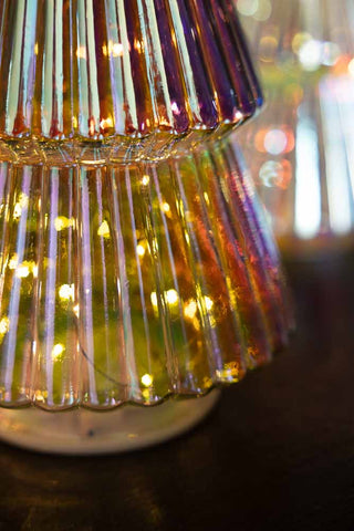 Close-up of the base of the Large Glass Christmas Tree With LED Lights with the lights switched on.