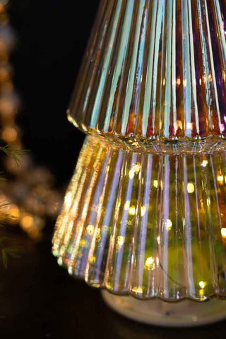 Detail shot of the base of the Large Glass Christmas Tree With LED Lights with the lights switched on.