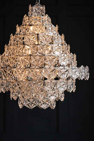 Close-up image of the Showstopping Multi-Layer Glass Chandelier lit up