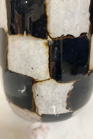 Side view of the black and white vase.