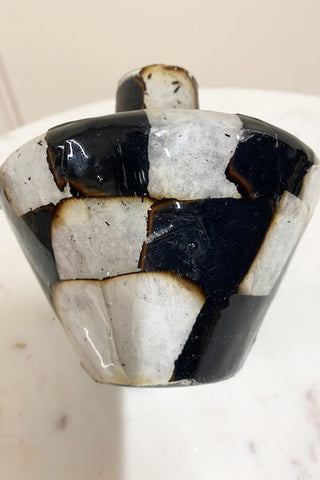 Side view of the slightly marked and scuffed Black and White Checkerboard vase.