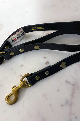 Beautiful black leather study dog lead with gold fixings and studded hearts.