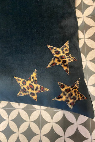 Detail of the three leather leopard stars in the right hand corner of the dog bed.