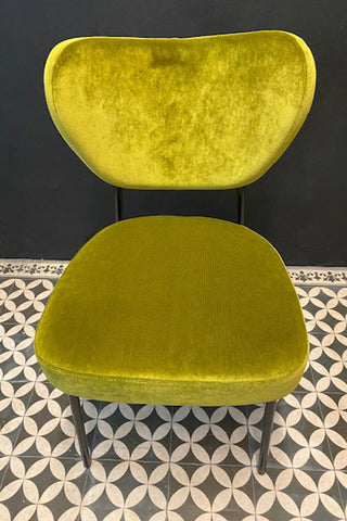 Beautiful verdant green dining chair facing forwards so you can see the texture of the velvet.