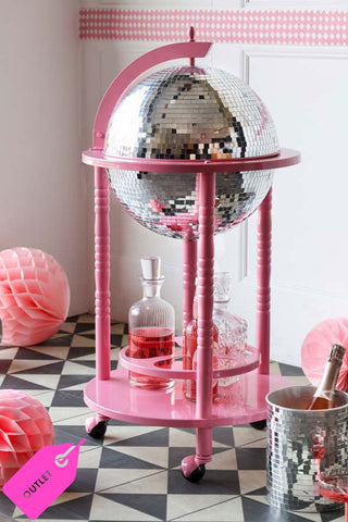 Pink framed disco ball drinks trolley surrounded by party accessories and an outlet label.