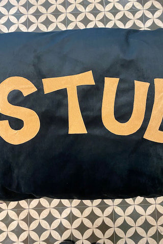 Example of the slightly imperfect lettering on the Stud bed, showing loose stitching.