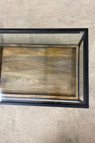 Birds-eye view of the brown wooden tray and the glass top.