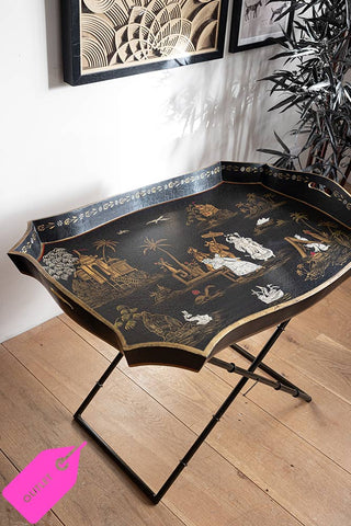 Beautiful tray table with chinoiserie details with a pink outlet label in the bottom left corner.