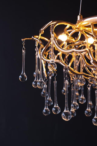 Close-up image of the droplets on the Rose Gold Droplet Chandelier lit up