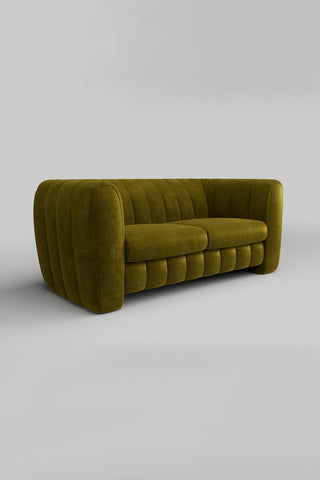 The Bowie Large Sofa In Luxe Kneedlecord Velvet Vintage Green on a plain background, seen from a side angle.