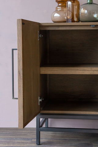 Close-up image of the shelves inside the Timber Strips Sideboard with the door open