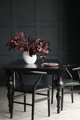 Close-up lifestyle image of the Traditional Black Oak Dining Table