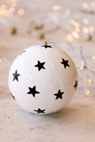 Lifestyle image of the White Christmas Decoration With Black Stars