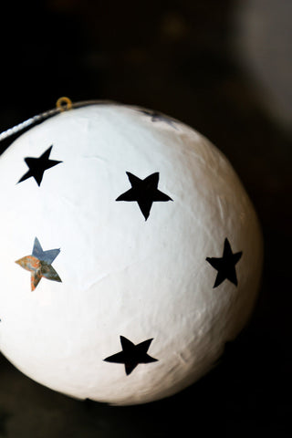 Close-up image of the White Christmas Decoration With Black Stars